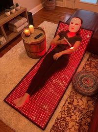 Total Body Reset system family — mat with face mask and wand (kit context)