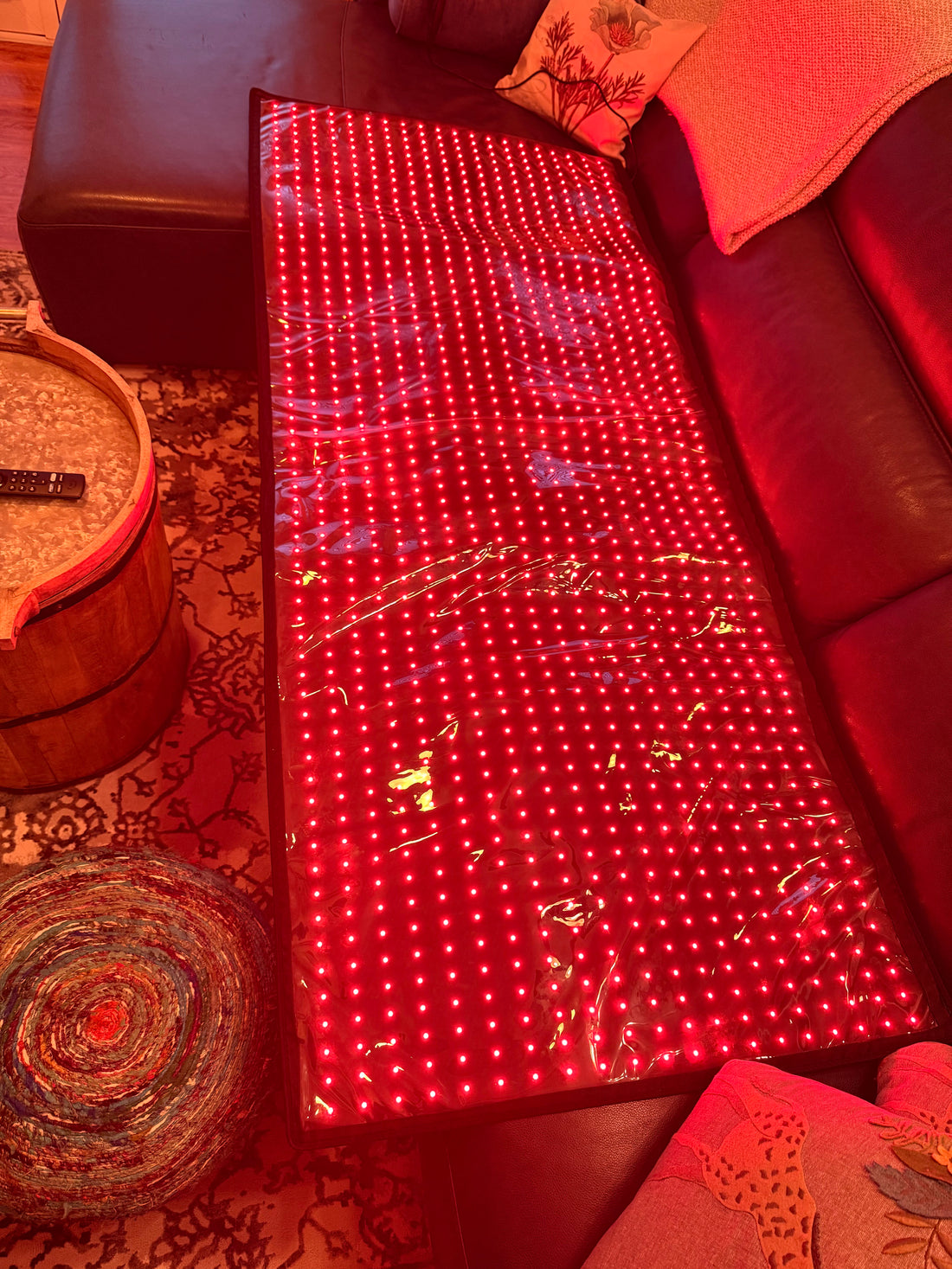 Total Body Reset mat glowing — full LED array, thin edge profile