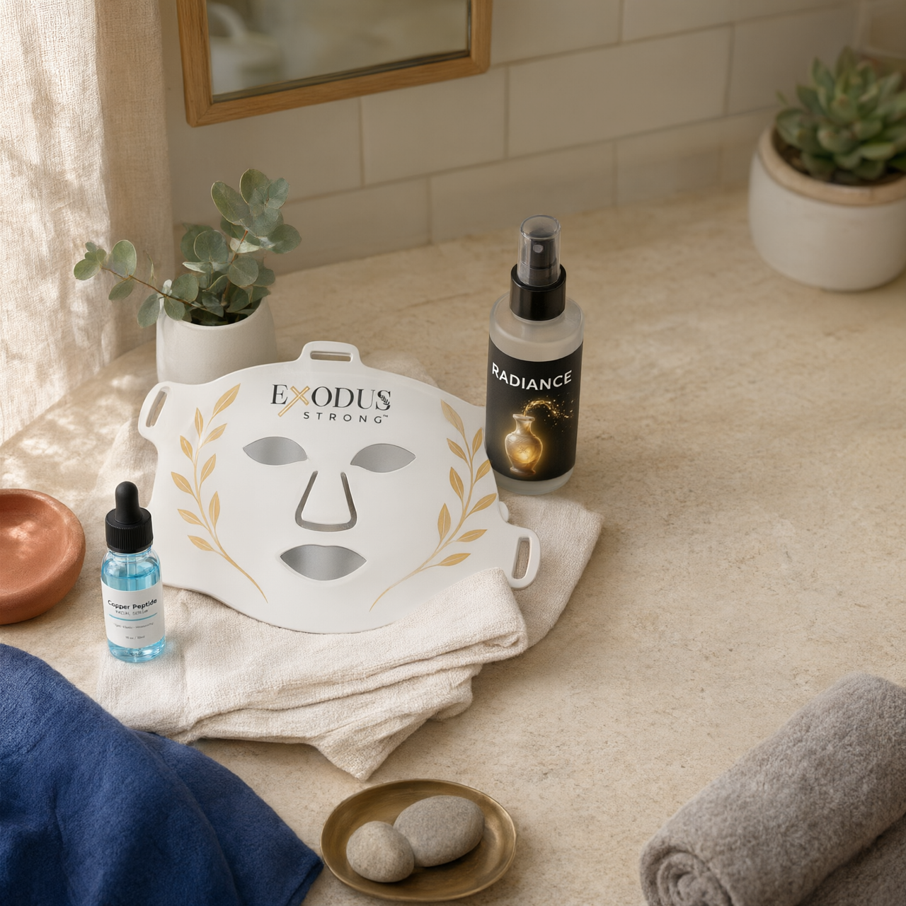 The Radiance System: face mask, serum and mist on a bathroom counter