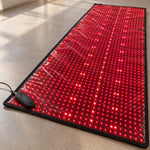 The Red Light+ Laser Mat grid up close with the controller at the corner